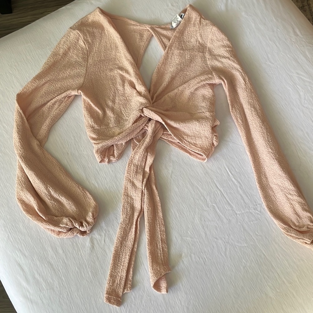 Womens crop top, wraps around and ties in the back.